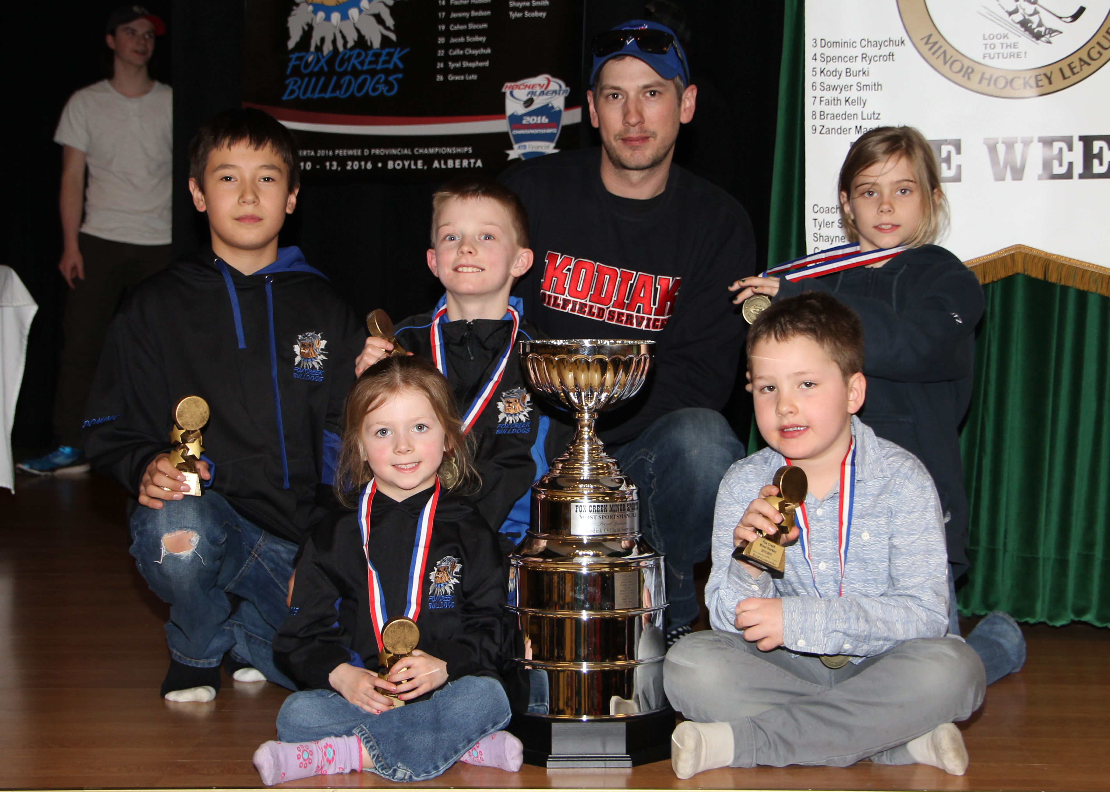 Andrew Slocum, alongside recipients of the Most Sportsmanlike Player Award, sponsored by Kodiak Oilfield Services.